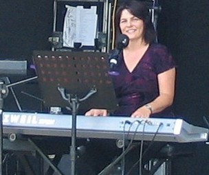 Nicole playing piano at Concert in the Orchard